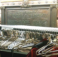 Memorial Plaques hidden behind a coat rack